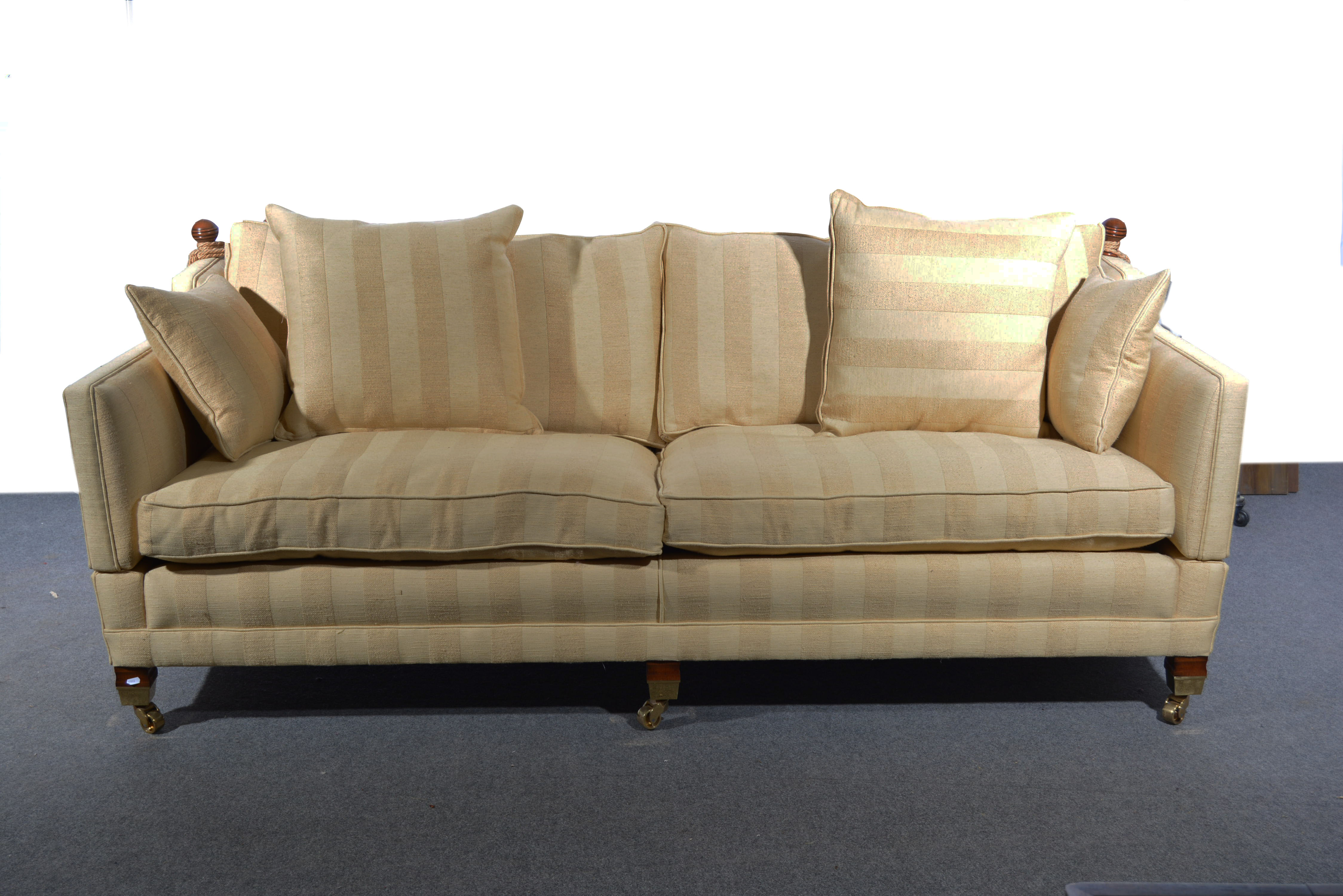 Large Duresta sofa, Knoll type back, square tapering legs with brass caps and castors,