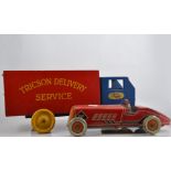 A toy tin plate English racing car, pond yacht, Tricson wooden delivery lorry,