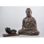 Eastern carved stone fragment, mounted on a plaque, height 12cms, a pewter model of a seated Buddha,