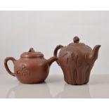 Chinese Red ware leaf moulded teapot, Yixing seal mark, 15cms and four other teapots, (5).