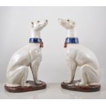 Pair of Majolica style models, of seated hounds, perhaps Italian, 37cms.