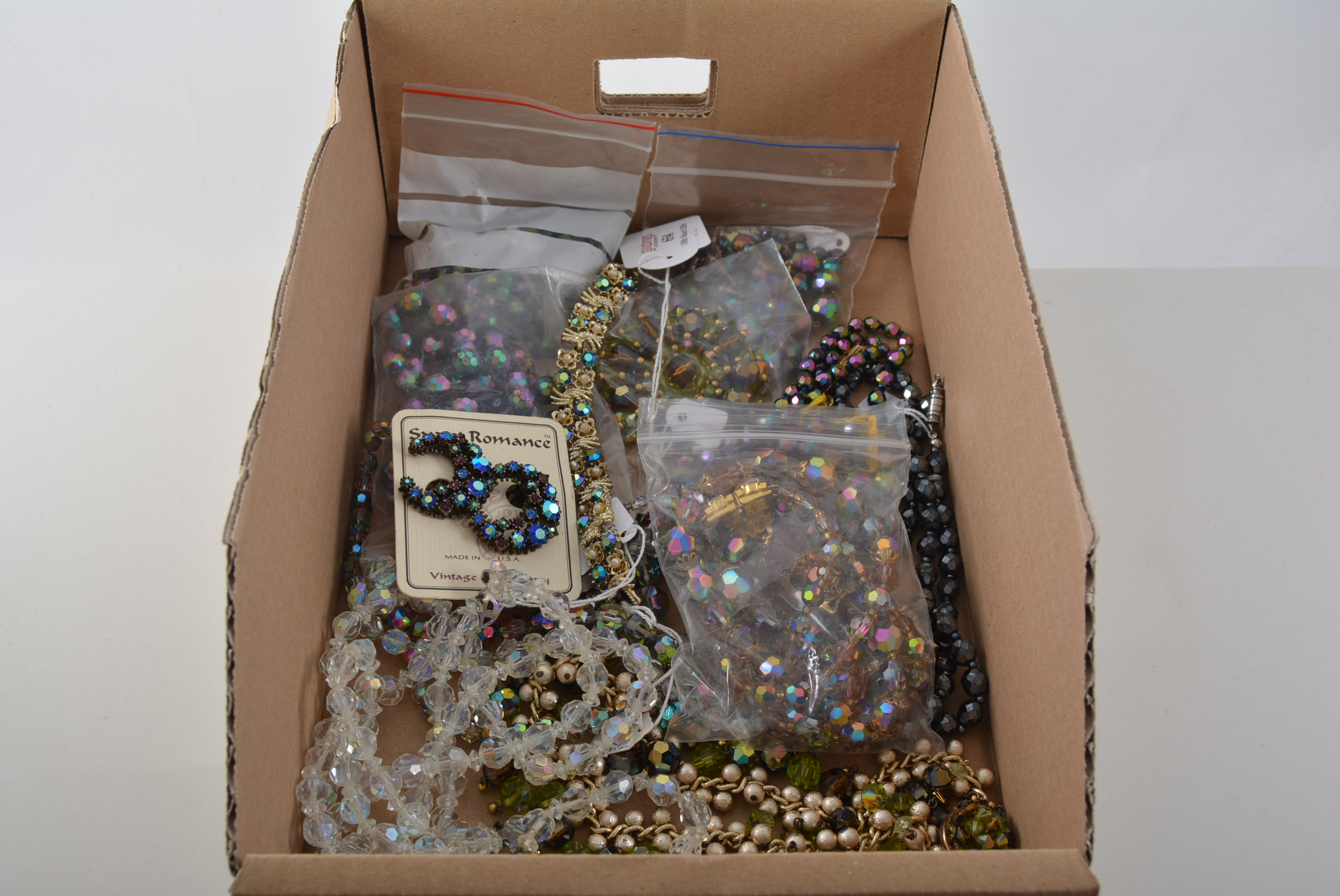 Costume jewellery, a collection of vintage crystal necklaces, 1950's aurora beads, bracelet, brooch.