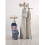 Lladro group of two nuns, 33cm and another Lladro figure of a Nun, (2).