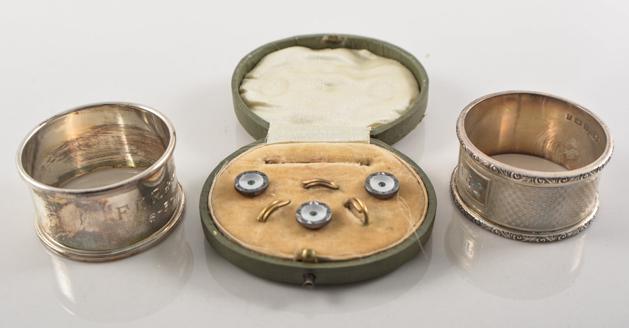 Part set of mother of pearl faced studs, two silver napkin rings, cufflinks, studs etc.