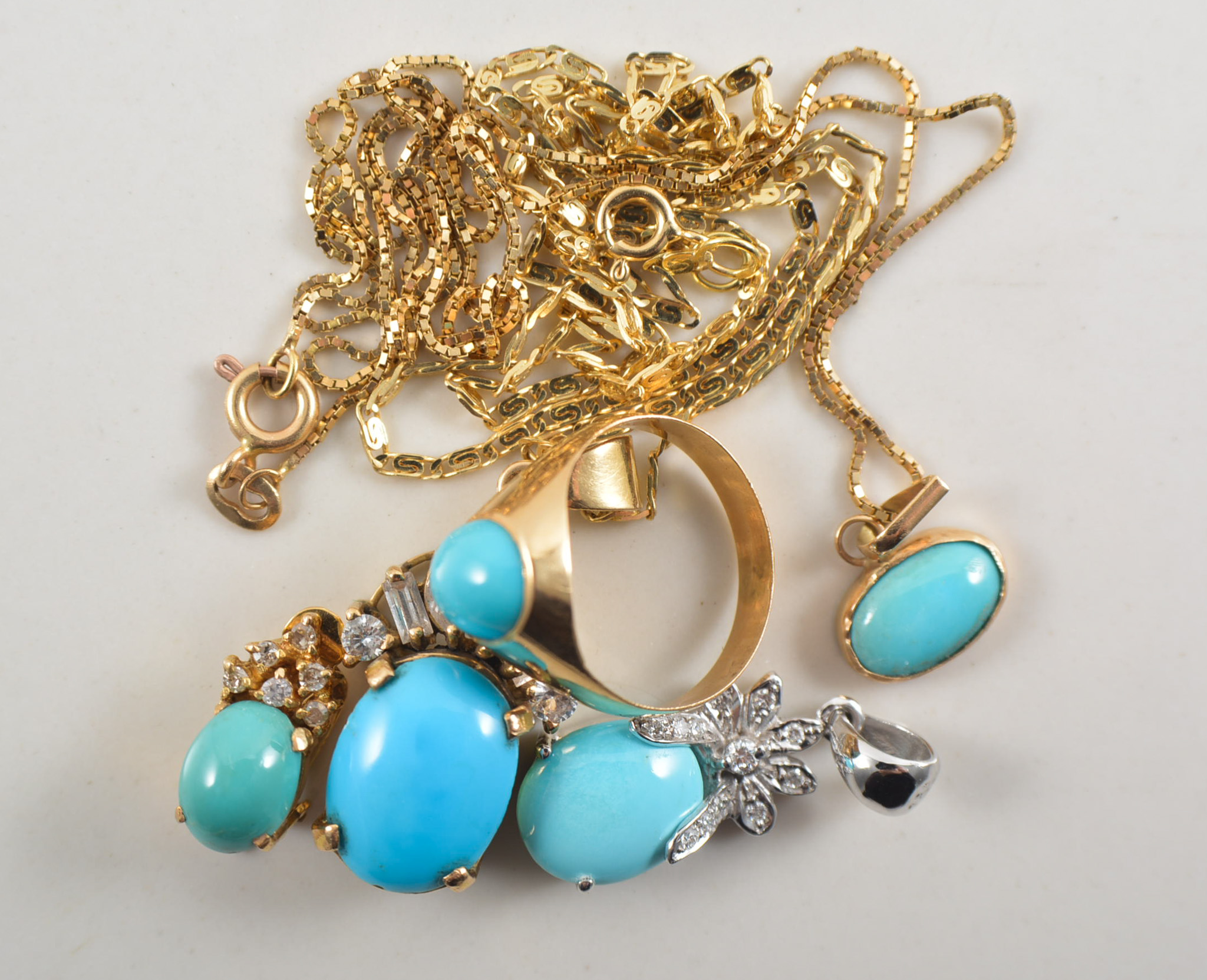 Collection of turquoise jewellery, some matching, comprising two pendants and chains,