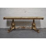 Cast brass and onyx coffee table, rectangular top with a moulded edge, splayed legs, length 120cm,