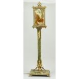 Onyx and brass table lamp, lantern top, square column and plinth with paw feet, height 78cm.