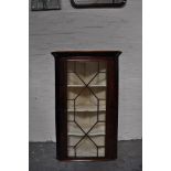 Victorian mahogany hanging corner cupboard, moulded cornice, astragal glazed door,