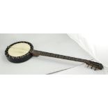 Stained wood six string Banjo, stamped 713, overall length 95cm, leather case (a.f.).