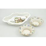 Pair of Continental porcelain basket work bowls encrusted with flowers,