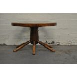 Stained beechwood occasional table, designed as a ships wheel, circular plate glass top,