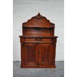 Victorian mahogany chiffonier, raised back with scrolled outlines, serpentine shelves,