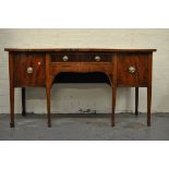 George III mahogany serpentine sideboard, top with broad crossbanding, boxwood and ebony stringing,