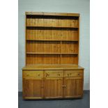 Large pine dresser, panel back with three fixed shelves, base with rectangular top,