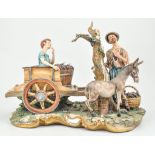 Large Capodimonte porcelain group, "La Vendemmia" (The Grape Harvest), signed Volta, length 42cm.