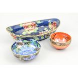 Five Maling lustre ware bowls, circa 1925, the largest of oval form with 'Peony' design,