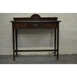 Edwardian mahogany hall table, rectangular top with a shallow arched back, moulded edge,