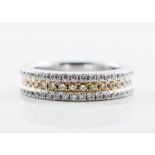 A diamond three row half eternity ring, the two outer rows each having brilliant cut diamonds (20),