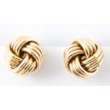 A pair of yellow metal polished knot design earrings, 20mm diameter, pierced fittings with clips,