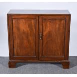 A George III mahogany dwarf cabinet, reeded outlines, two panel doors, bracket feet, width 84cm,