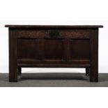 A joined oak coffer, basically late 17th Century, of small size, three panel hinge lid,