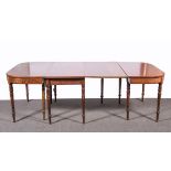 A George III mahogany dining table, rectangular top with rounded corners, plain frieze,