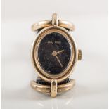 Roy King - a lady's wristwatch having a plain black oval dial in a 9 carat yellow gold case with