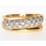 A diamond set dress ring, a yellow metal crossover band inset with diamonds (25),