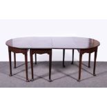 A George III style mahogany D end dining table, with a drop leaf centre section, broad crossbanding,