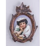 Two German porcelain oval plaques, Tyrolean man and a Neapolitan girl, over print foundations, 8.