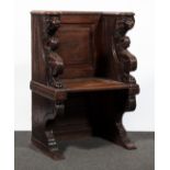 A joined and carved oak choir stall, 17th Century style, probably 19th Century with a panelled back,