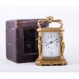 A French gilt metal repeating carriage clock, cast and ornamented case,