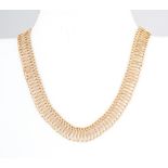 A hallmarked 18 carat yellow gold necklace, interwoven loop and ball flexible fringe design,