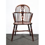 A Victorian yew wood and elm low back Windsor chair, narrow arms, pierced vase splat, shaped seat,