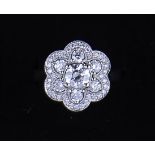 A diamond circular floral cluster ring,