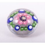 A small Clichy patterned Millefiore paperweight, mid 19th Century, garlanded surround, diameter 4.