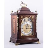 A Late Victorian mahogany bracket clock, in the Georgian style, moulded hood and plinth base,