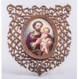 A German porcelain oval plaque, Berlin style, St Joseph and the Christ Child, 11cm x 8cm,