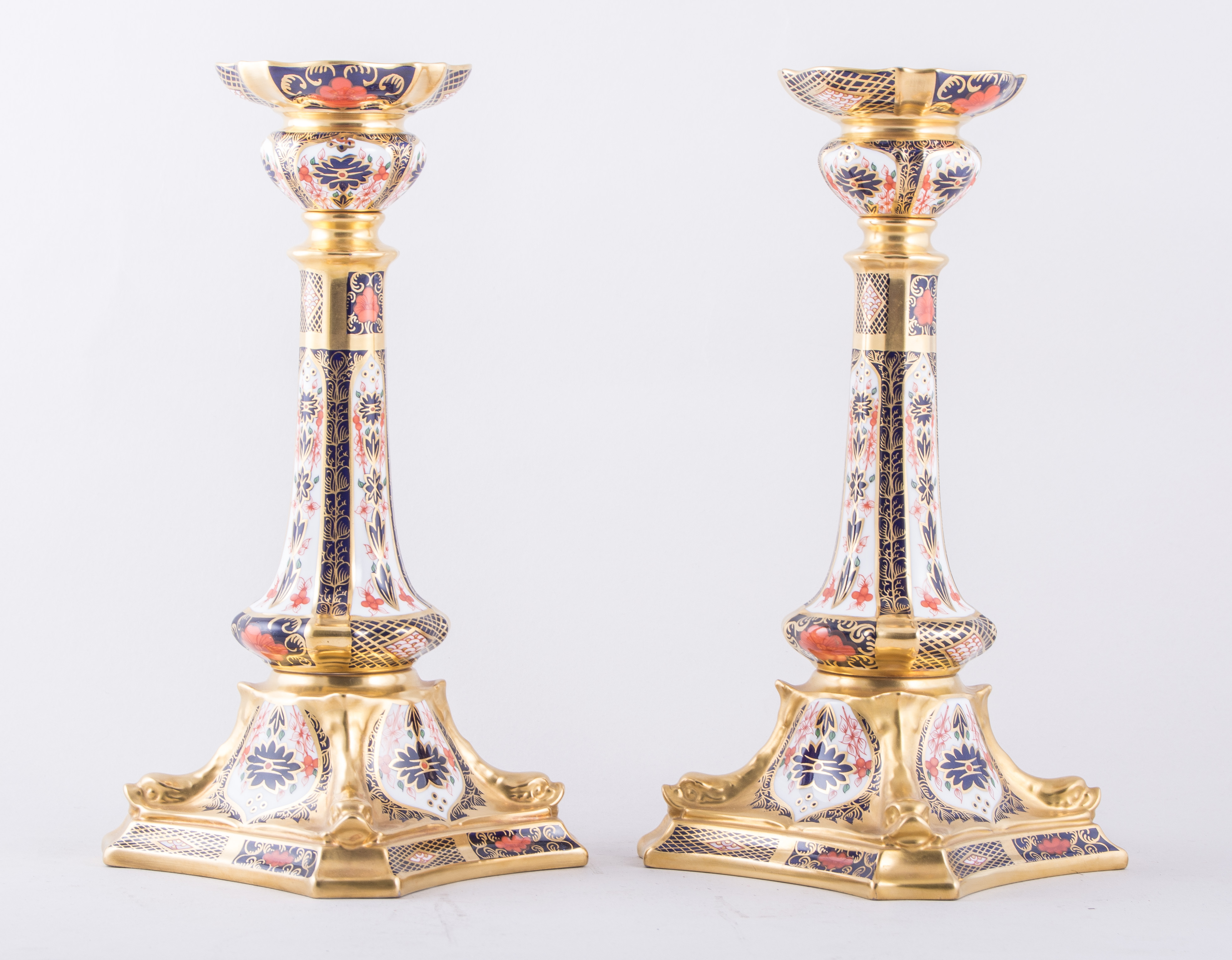 A pair of Royal Crown Derby bone china silver shaped candlesticks, 1987, Old Imari pattern, No.