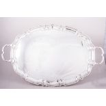 An oval silver tea tray, by J B Chatterley & Sons Limited, Birmingham 1971, moulded outline,