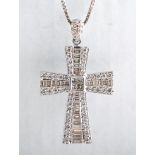 A diamond set cross, diamonds (29), taperd baguette cut stones, surrounded by diamonds (48),