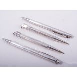 Two pairs of silver Eversharp pencils, one pair having plain polished hexagonal barrels, 12cm long,