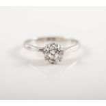 A diamond solitaire ring,