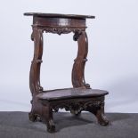 An Italian walnut prie dieu, 18th Century, curved top with carved rococo armorial,