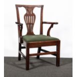 A George III Country made Chippendale style elbow chair, pierced vase splat, open arms,