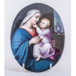 A German porcelain oval plaque, probably Berlin, a Raphaelite Madonna and Child, unframed,