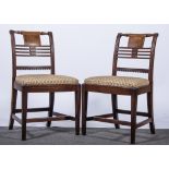 A set of five Regency mahogany dining chairs,