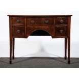 A George III mahogany bowfront sideboard, of small size, fitted with a central drawer,