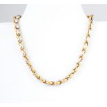 A hallmarked 18 carat white and yellow gold necklace,