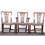 A set of twelve George III type design mahogany dining chairs, shape crestings,